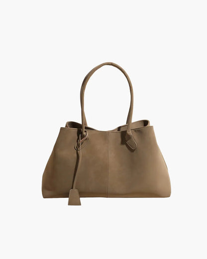Beige large vegan suede handbag for women with retro style and double handles.