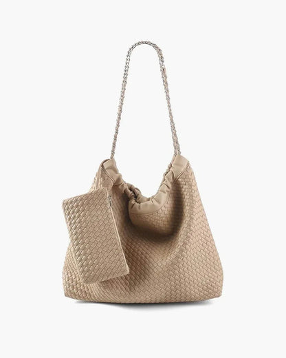 Beige woven shoulder bag with chain handle and matching pouch on white background