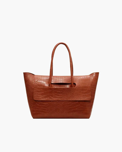 Brown crocodile pattern large tote handbag for women with double handles on white background